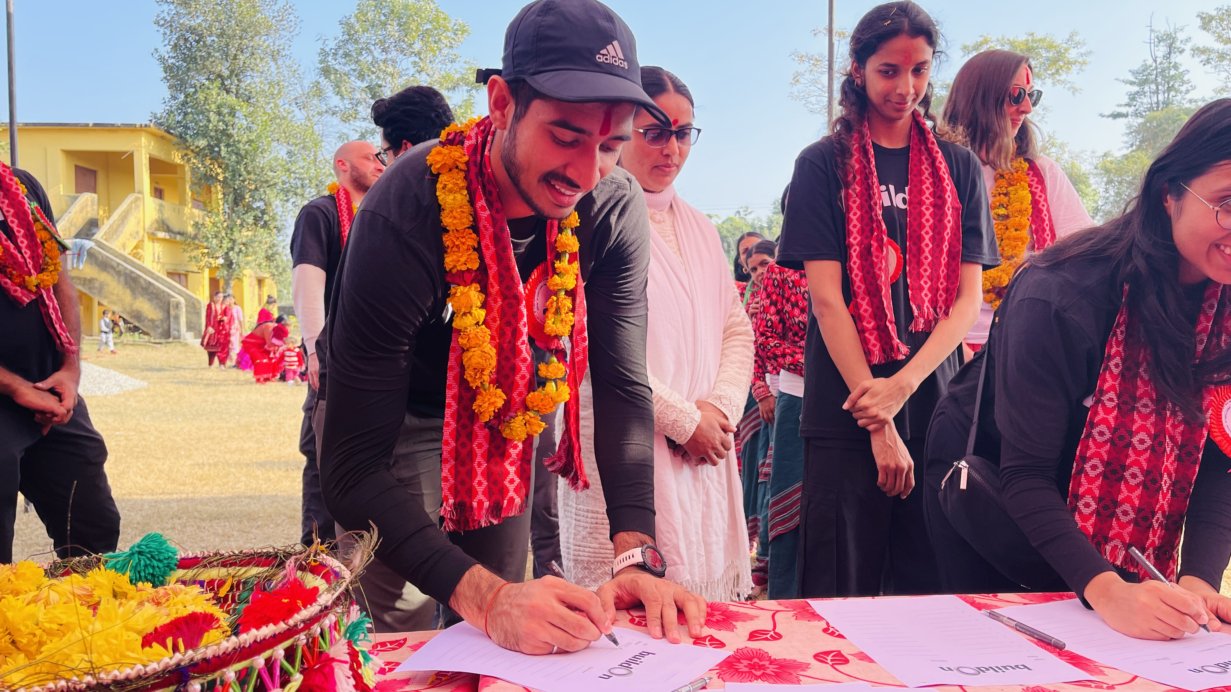 Covenant signing ceremony between buildOn and village community