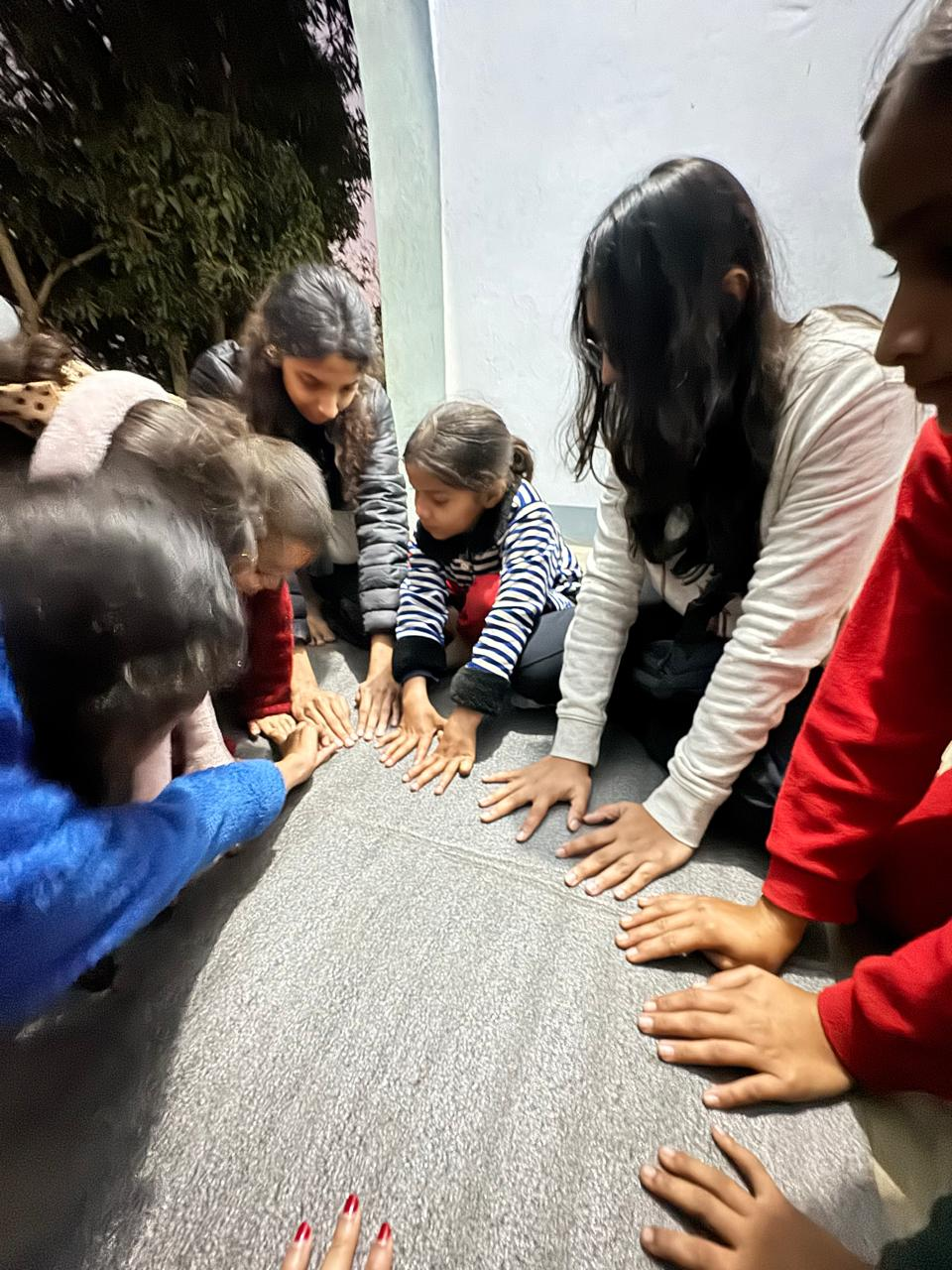 Playing hand games with the girls